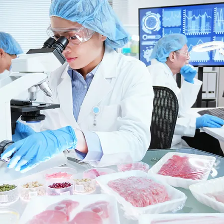 Food safety workers inspecting foods in a laboratory