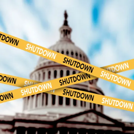 The U.S. Capitol dome behind caution tape with the word SHUTDOWN on it