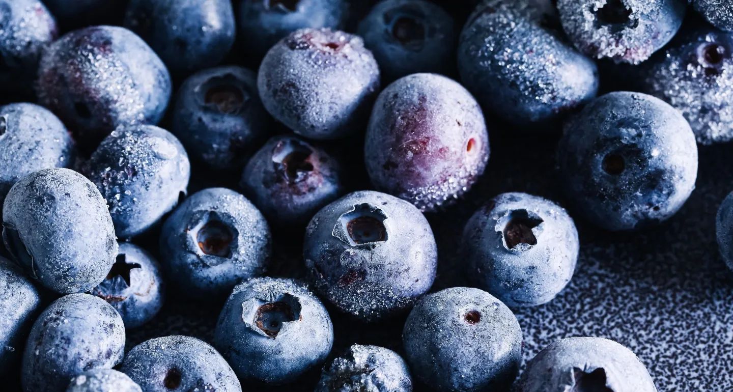Frozen blueberries closeup with frost texture