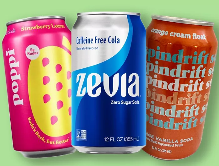 Cans of Poppi strawberry lemon, Zevia caffeine free cola and spindrift orange vanilla soda