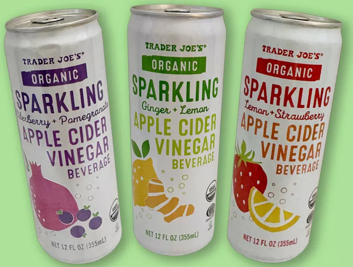 3 cans of Trader Joe's Organic sparkling apple cider vinegar beverage. Flavors: wildberry + pomegranate, ginger + lemon and lemon + strawberry