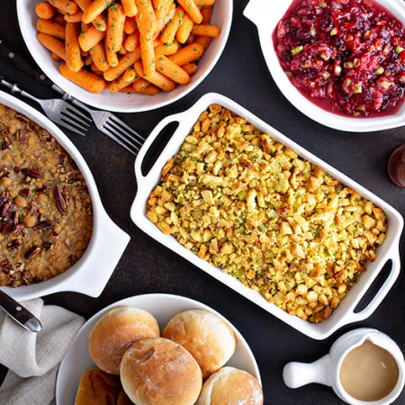 Variety of dishes at a Thanksgiving meal table
