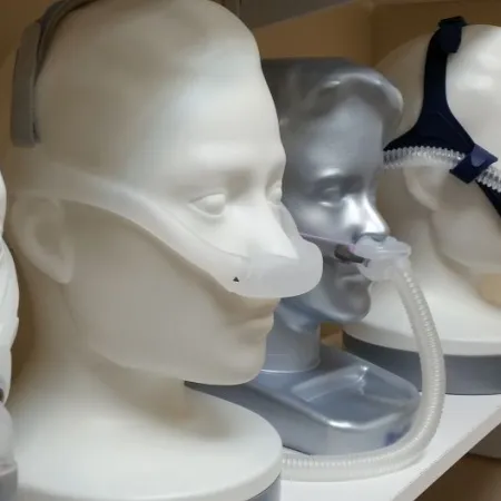 Model heads wearing various CPAP machines